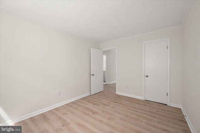 12505 Assawoman Dr, Ocean City, MD 21842 - unfurnished bedroom featuring light wood-style flooring, baseboards, and crown molding