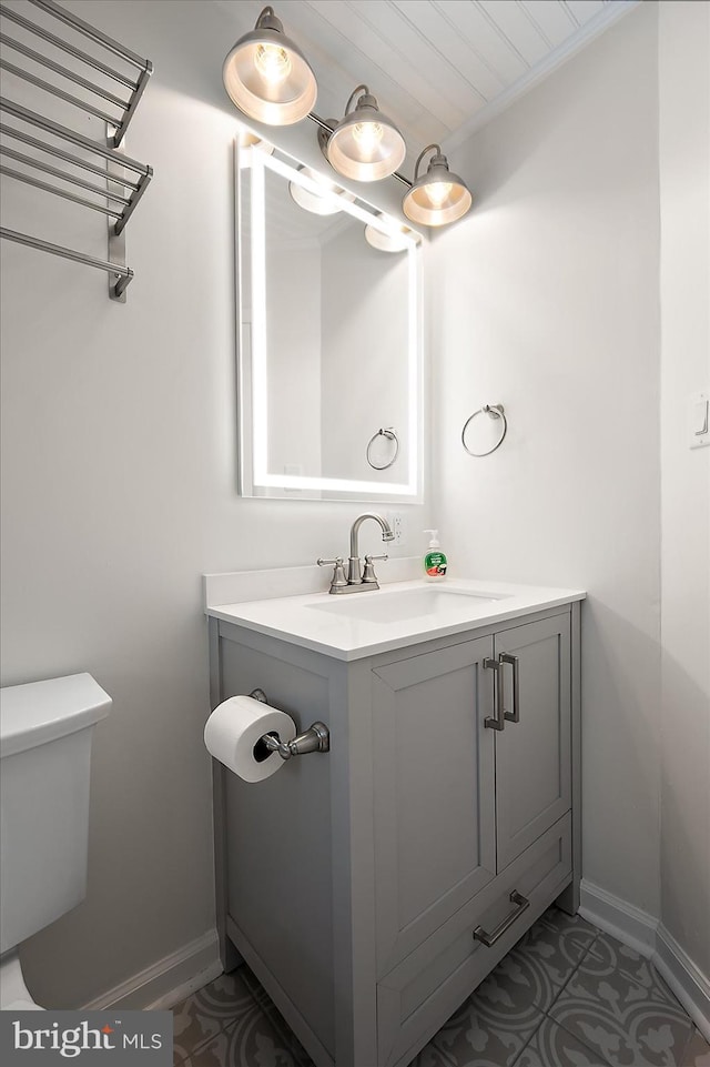 12505 Assawoman Dr, Ocean City, MD 21842 - half bathroom with baseboards, toilet, and vanity