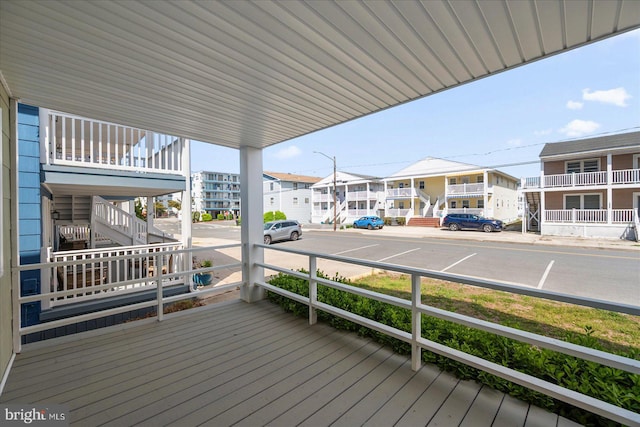 12505 Assawoman Dr, Ocean City, MD 21842 - wooden deck featuring a residential view and stairs