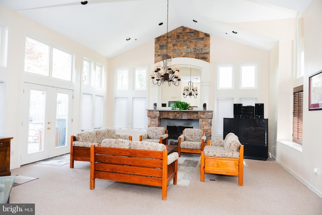 living room featuring baseboards, high vaulted ceiling, a notable chandelier, and light colored carpet
