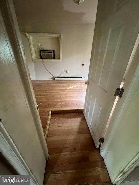 18506 Triangle St, Triangle, VA 22172 - hall with an AC wall unit and hardwood / wood-style floors