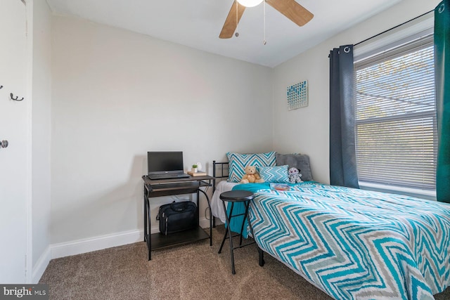 bedroom with carpet floors, a ceiling fan, and baseboards