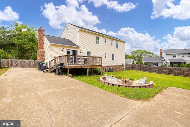 202 Stern Cv, Stafford, VA 22554 - rear view of house with a gate, an outdoor fire pit, a wooden deck, central AC unit, and a patio area