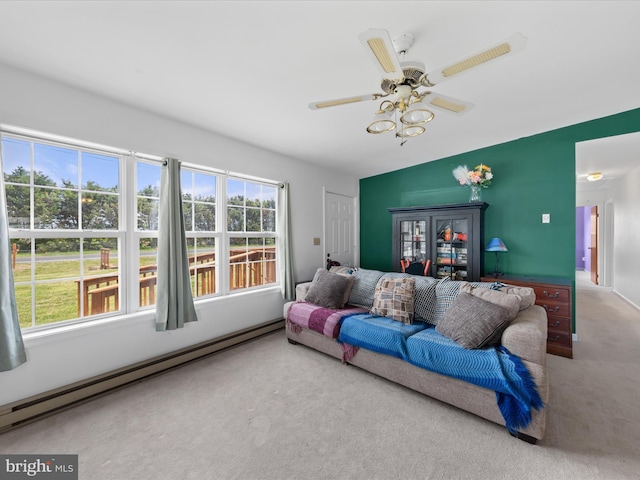 carpeted living room with a baseboard heating unit, a ceiling fan, and vaulted ceiling