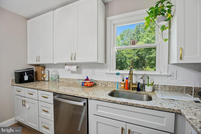 23745 Hicks Dr, Leonardtown, MD 20650 - kitchen featuring dishwasher, a sink, white cabinets, decorative backsplash, and light stone countertops
