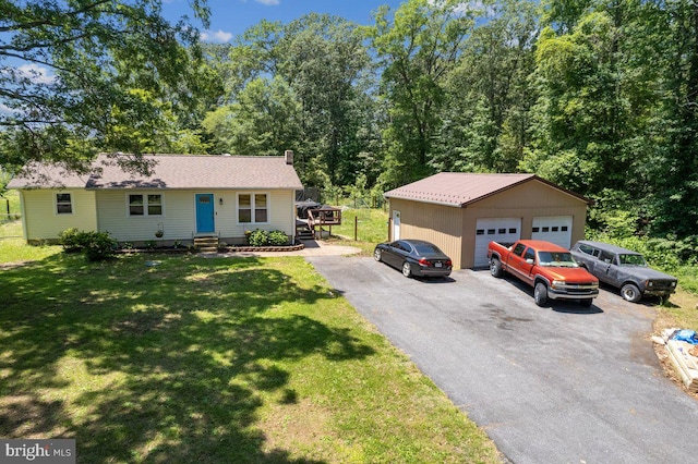 23745 Hicks Dr, Leonardtown, MD 20650 - single story home featuring a garage, an outdoor structure, a front lawn, and entry steps
