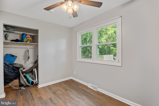 23745 Hicks Dr, Leonardtown, MD 20650 - spare room with wood finished floors, baseboards, ceiling fan, and plenty of natural light