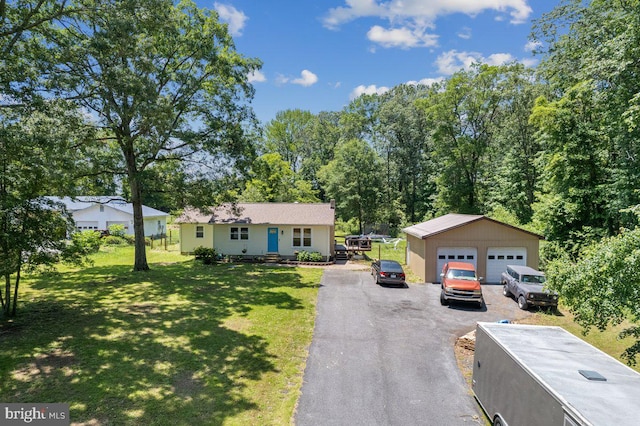 23745 Hicks Dr, Leonardtown, MD 20650 - ranch-style home with a detached garage, an outbuilding, and a front lawn