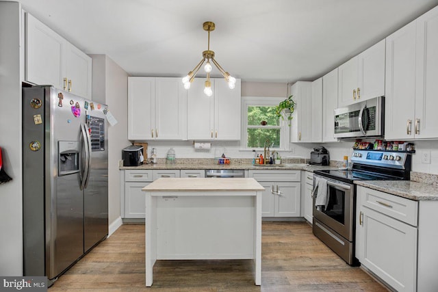 23745 Hicks Dr, Leonardtown, MD 20650 - kitchen featuring appliances with stainless steel finishes, a sink, and white cabinetry