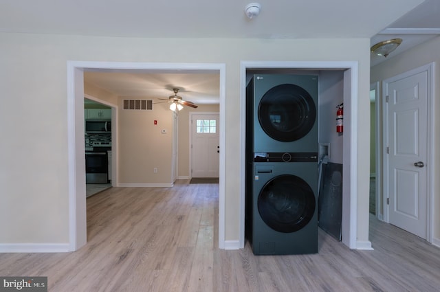 179 Mannington Yorketown Rd, Woodstown, NJ 08098 - laundry room featuring stacked washing machine and dryer, ceiling fan, light wood-style flooring, and baseboards