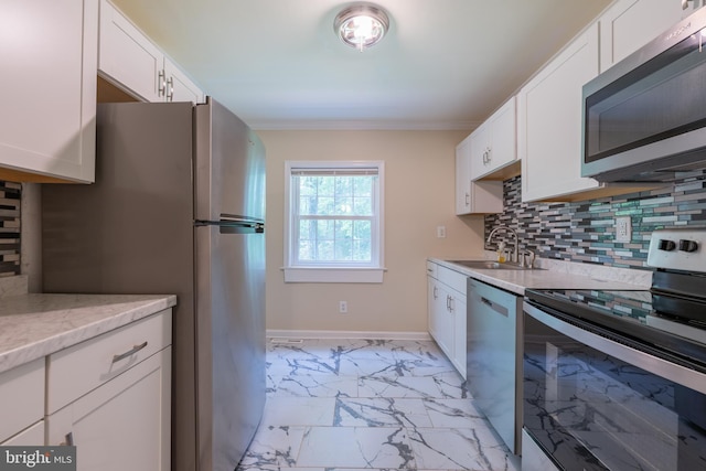 179 Mannington Yorketown Rd, Woodstown, NJ 08098 - kitchen featuring stainless steel appliances, light marble finish flooring, a sink, white cabinetry, and backsplash