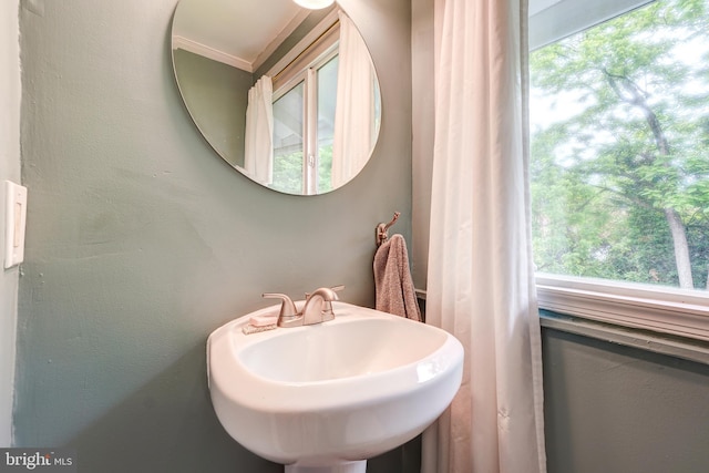 bathroom featuring plenty of natural light and a sink