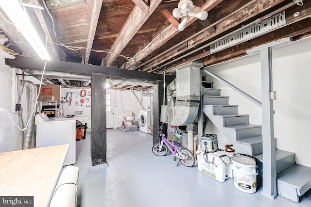 unfinished below grade area with washer and dryer and stairway