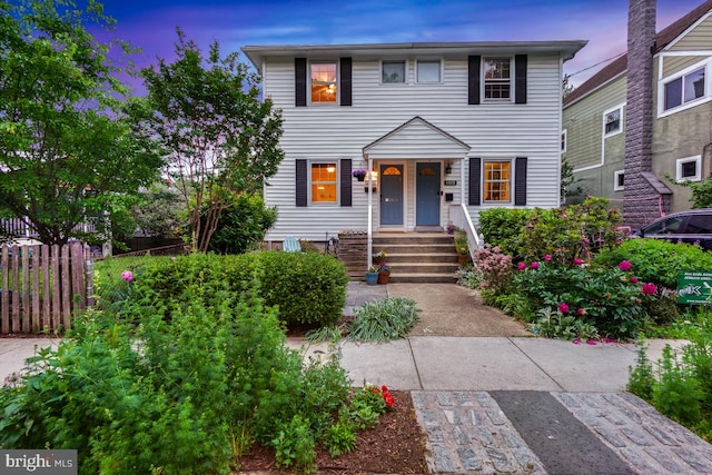 view of front of house with fence