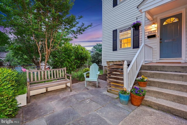 property entrance with a patio