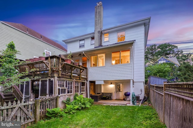 rear view of house with a balcony and a patio area
