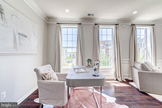home office with dark wood-style flooring, visible vents, ornamental molding, and plenty of natural light