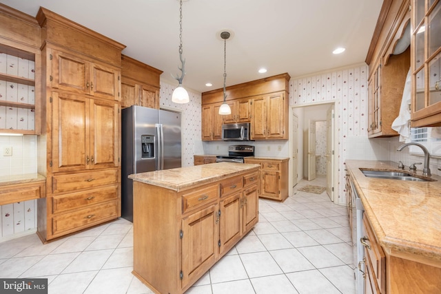 kitchen featuring a sink, wallpapered walls, decorative backsplash, stainless steel appliances, and a kitchen island