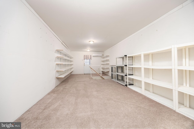 interior space with an AC wall unit and carpet floors