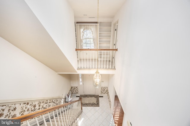 stairway featuring tile patterned floors
