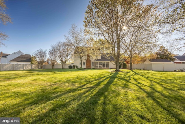 view of yard featuring a fenced backyard