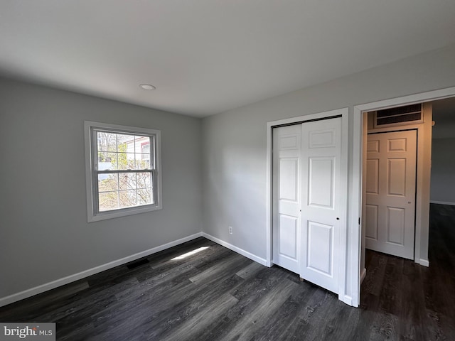 15 Excell Ln, Willingboro, NJ 08046 - unfurnished bedroom featuring dark wood finished floors, baseboards, and a closet