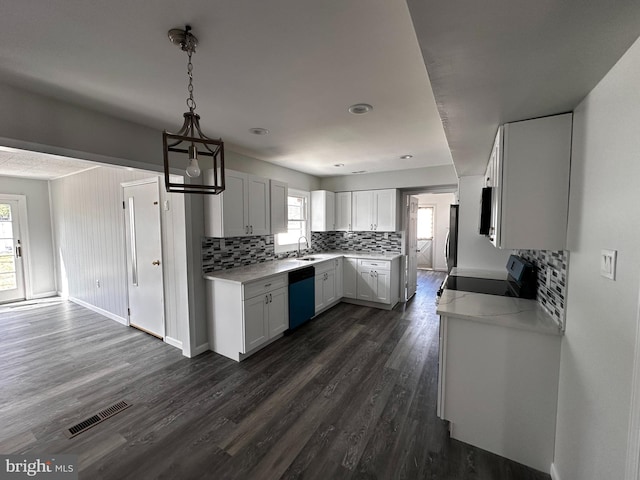 15 Excell Ln, Willingboro, NJ 08046 - kitchen with dishwashing machine, a sink, electric range oven, decorative backsplash, and dark wood finished floors