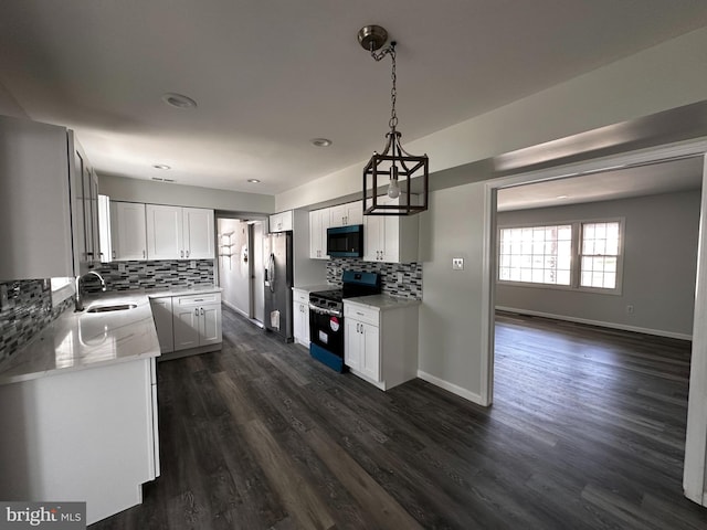 15 Excell Ln, Willingboro, NJ 08046 - kitchen featuring stainless steel appliances, a sink, decorative backsplash, dark wood-type flooring, and white cabinets