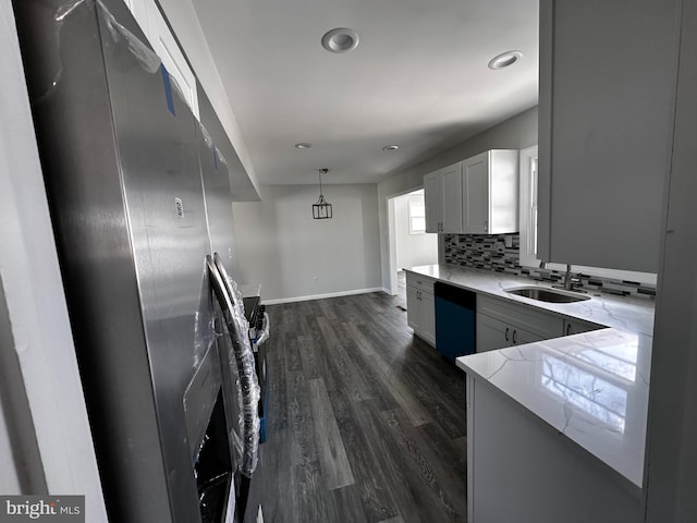 15 Excell Ln, Willingboro, NJ 08046 - kitchen with dishwasher, a sink, baseboards, dark wood-style flooring, and backsplash