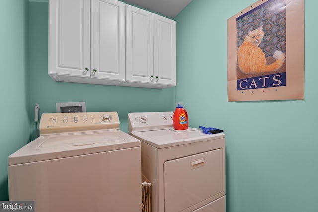 6609 Cheney Way, Gainesville, VA 20155 - laundry area featuring washing machine and dryer and cabinet space