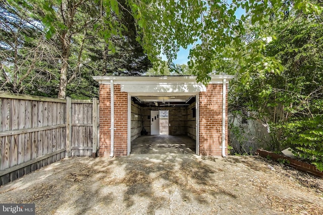 exterior space with fence and an outbuilding