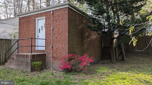 view of outdoor structure featuring fence