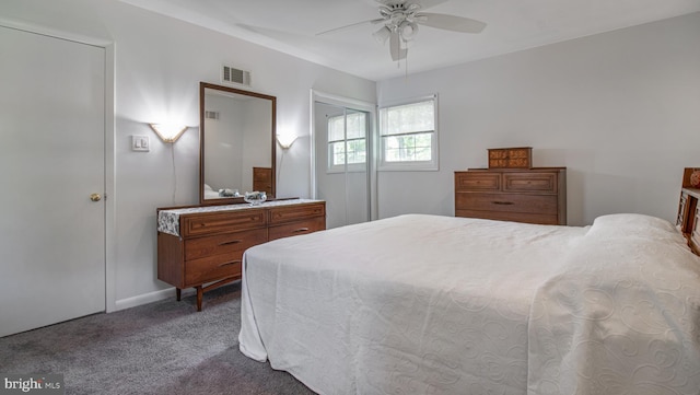 bedroom with visible vents, a ceiling fan, baseboards, and carpet floors
