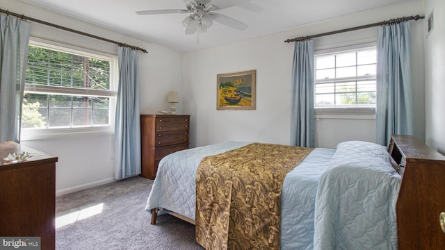 bedroom featuring baseboards, multiple windows, carpet flooring, and visible vents