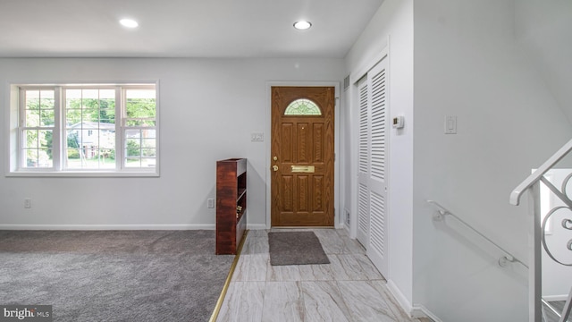 entrance foyer featuring recessed lighting, baseboards, and a wealth of natural light