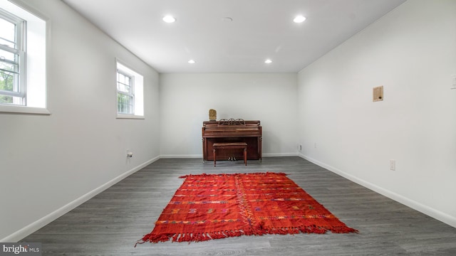 sitting room featuring baseboards, recessed lighting, and wood finished floors