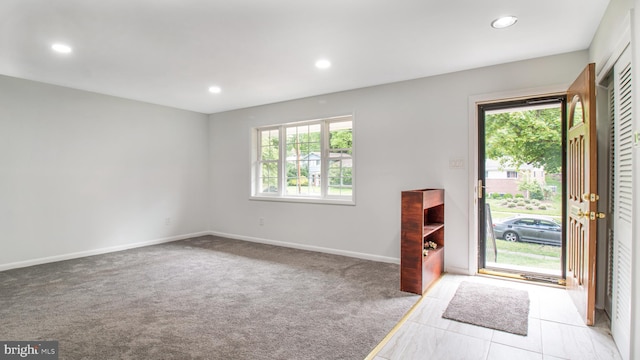 entryway with a healthy amount of sunlight and recessed lighting