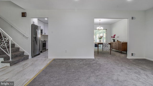 living area featuring an inviting chandelier, visible vents, baseboards, stairway, and light colored carpet