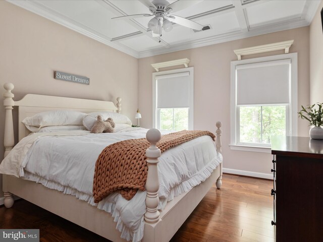 bedroom featuring baseboards, visible vents, ornamental molding, and coffered ceiling