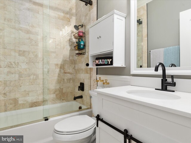 full bath with shower / bath combination with glass door, toilet, and vanity
