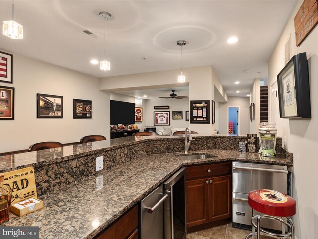 bar with pendant lighting, ceiling fan, recessed lighting, a sink, and dishwasher