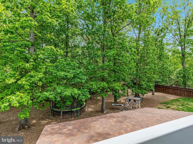 view of patio / terrace featuring fence