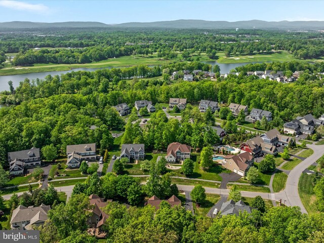 bird's eye view featuring a water view and a residential view