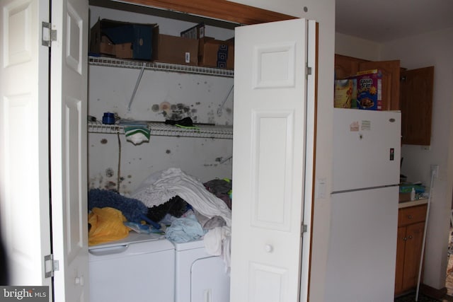 laundry room featuring washing machine and dryer