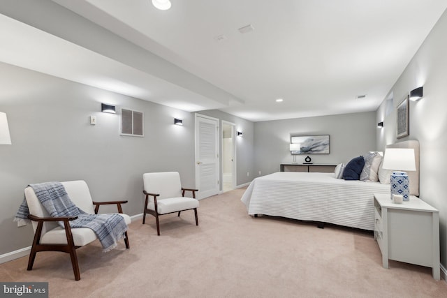 bedroom with light carpet, visible vents, and baseboards