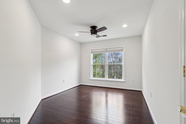 empty room featuring dark wood finished floors, baseboards, a ceiling fan, and recessed lighting