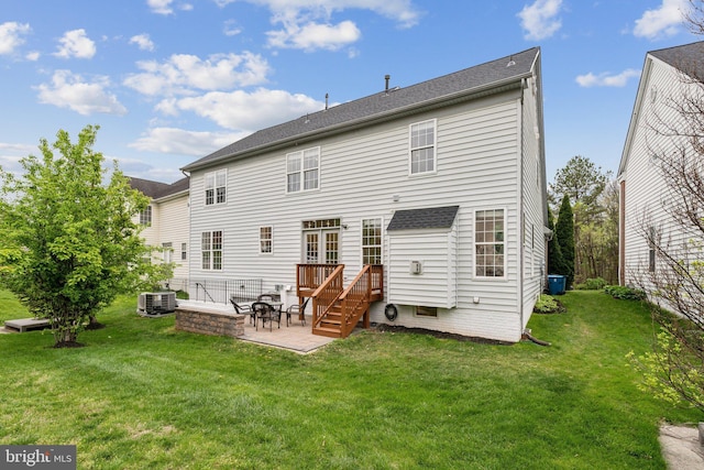 back of house with a lawn, a patio area, cooling unit, and a deck