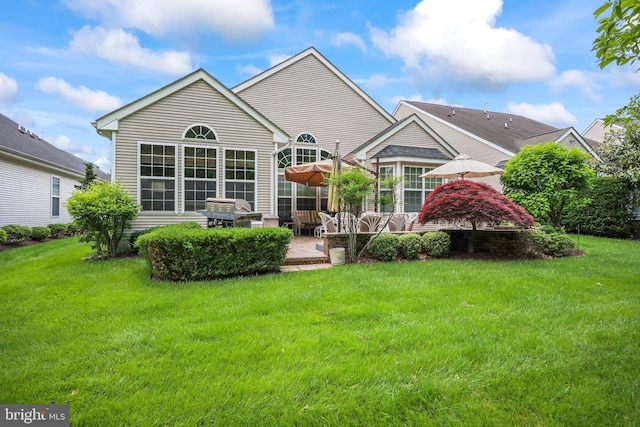 12 Citation Ln, Manalapan, NJ 07726 - back of house with a patio area and a yard