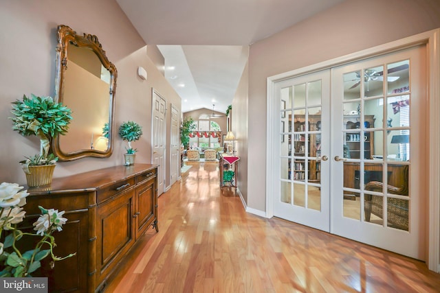 12 Citation Ln, Manalapan, NJ 07726 - corridor featuring vaulted ceiling, french doors, light wood-style floors, and baseboards