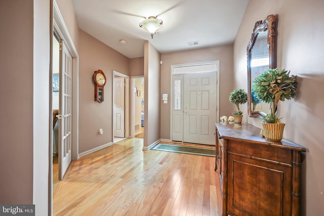 12 Citation Ln, Manalapan, NJ 07726 - foyer entrance featuring light wood-style floors and baseboards